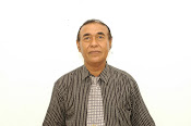 Drs. H. Erwan Kurtubi, M.M.
