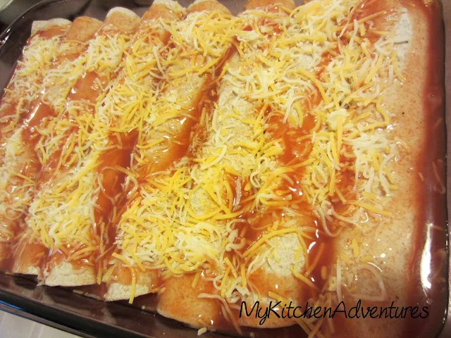 chicken and zucchini enchiladas in pan ready to bake
