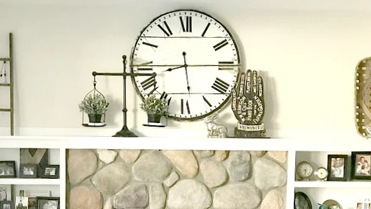 Mantel with clock, scale and ladder