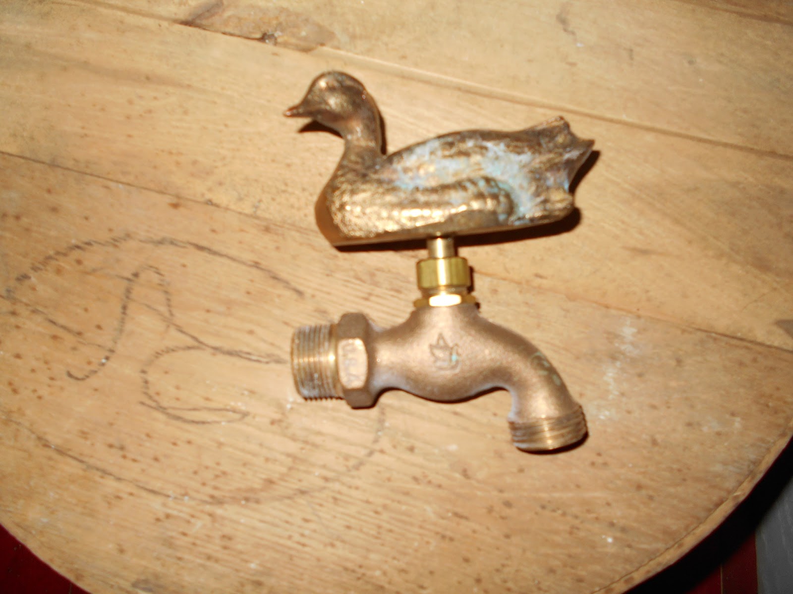 Log Cabin Antiques & Gifts Brass duck faucet