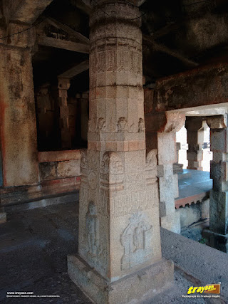 Ornate pillar with bas-relief carvings, inside the front porch of the temple