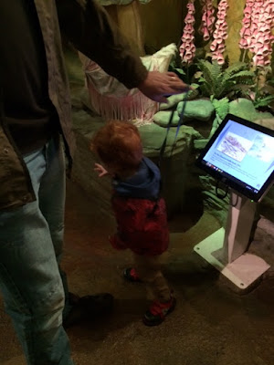 Daddy and toddler using a touchscreen