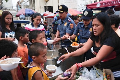 Feeding street children in Manila