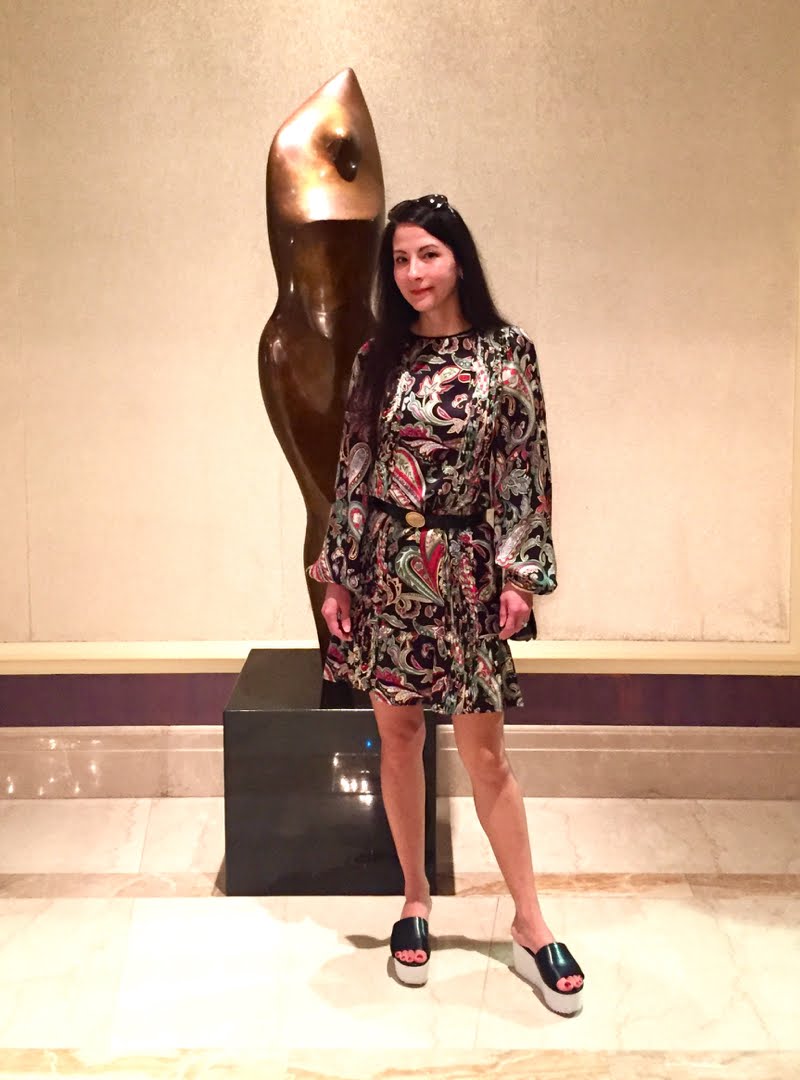 How to Style a Printed Dress for Day and Night - day look with sculpture Day look standing in front of sculptured art.