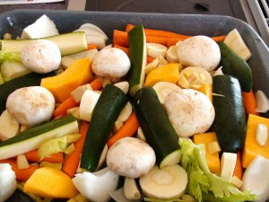 Vegetables in the roasting pan ready for the chicken to go on top.