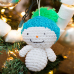 http://www.redheart.com/free-patterns/amigurumi-snowman-ornaments