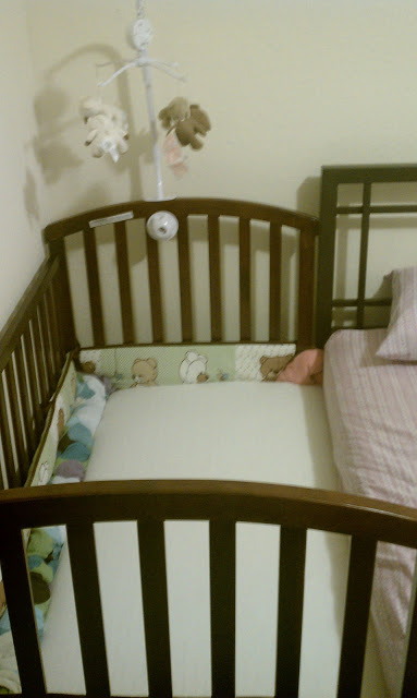 baby bed attached to bed