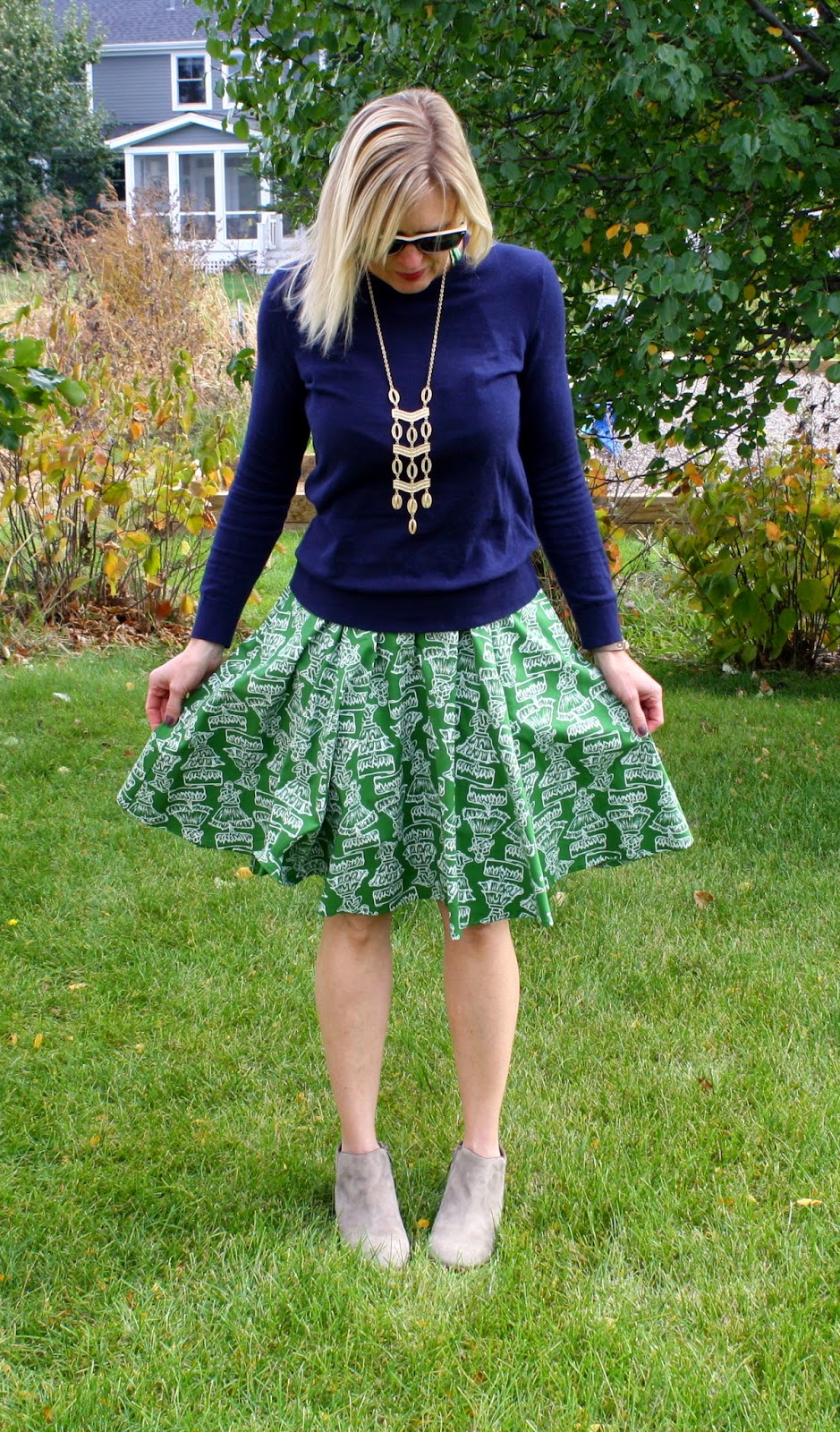 green printed dress and navy pullover