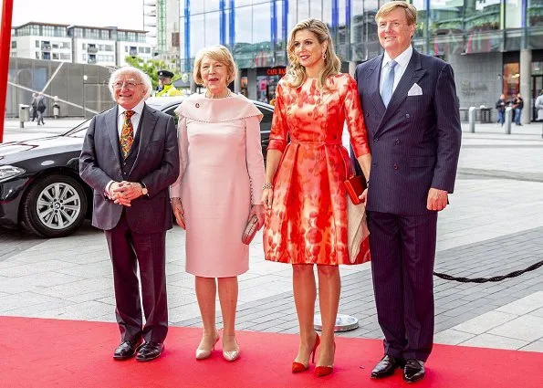 Queen Maxima's outfit is from the fashion house Natan floral print dress. President Michael Higgins and Sabina Higgins