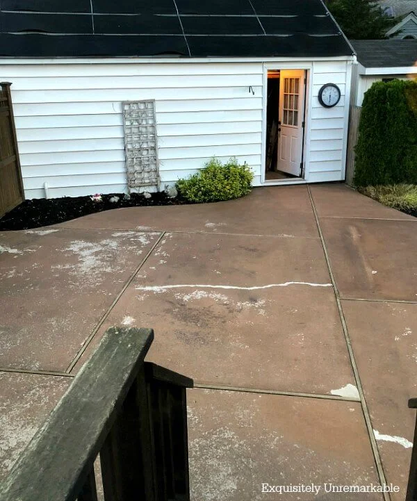 Chipped and cracked backyard patio in need of repair