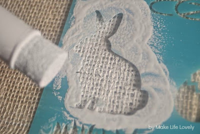 rabbit stencil one burlap with white paint and paint brush