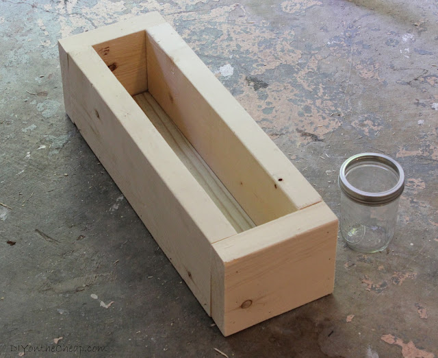 Scrap Wood + Mason Jar Centerpiece tutorial via DIYontheCheap.com