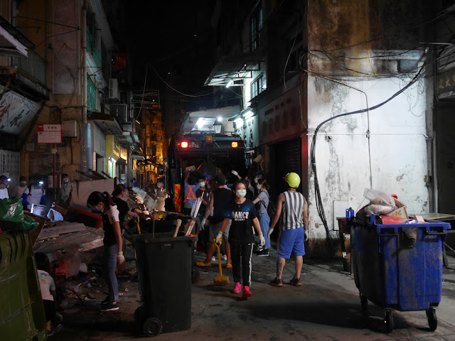 Cleanup from Typhoon Hato at night on Rua das Estalagens