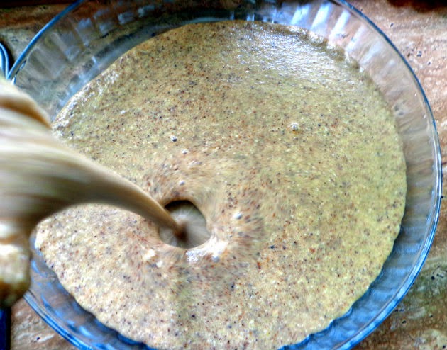 pouring mixture into a greased pie shape