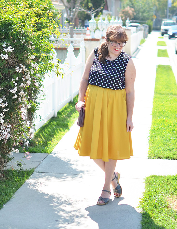 Thrifted polka dot top paired second-hand yellow midi skirt