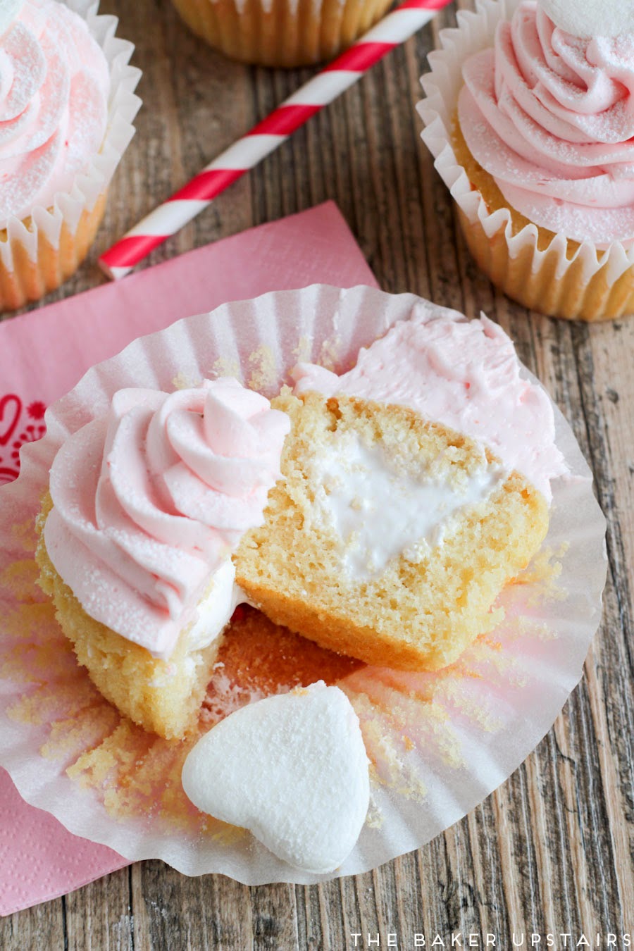 Strawberry marshmallow cupcakes - vanilla cupcakes filled with marshmallow cream and topped with a sweet strawberry marshmallow buttercream. Yum!