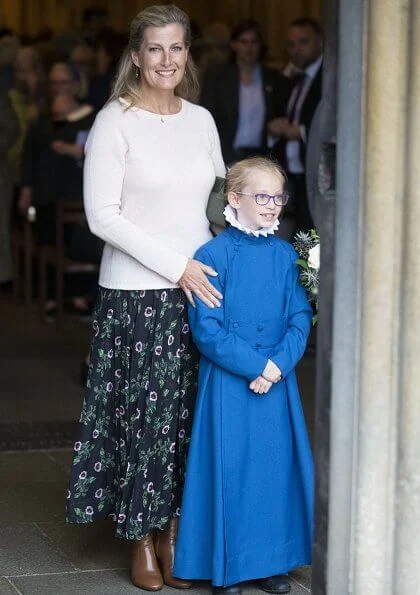 Countess of Wessex visited to join us in celebrating 25 years of Girl Choristers in Wells Cathedral Choir. floral print skirt and pink wool sweater