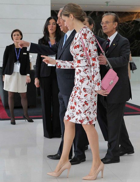 Uterque bag, Queen Letizia wore Zara wool coat in red, Carolina Herrera Floral Dress and Lodi Saray Pumps at European Conference in Porto