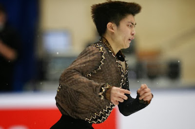 Han Yan (CHN) udfører sit korte program ved Cup of China 2013