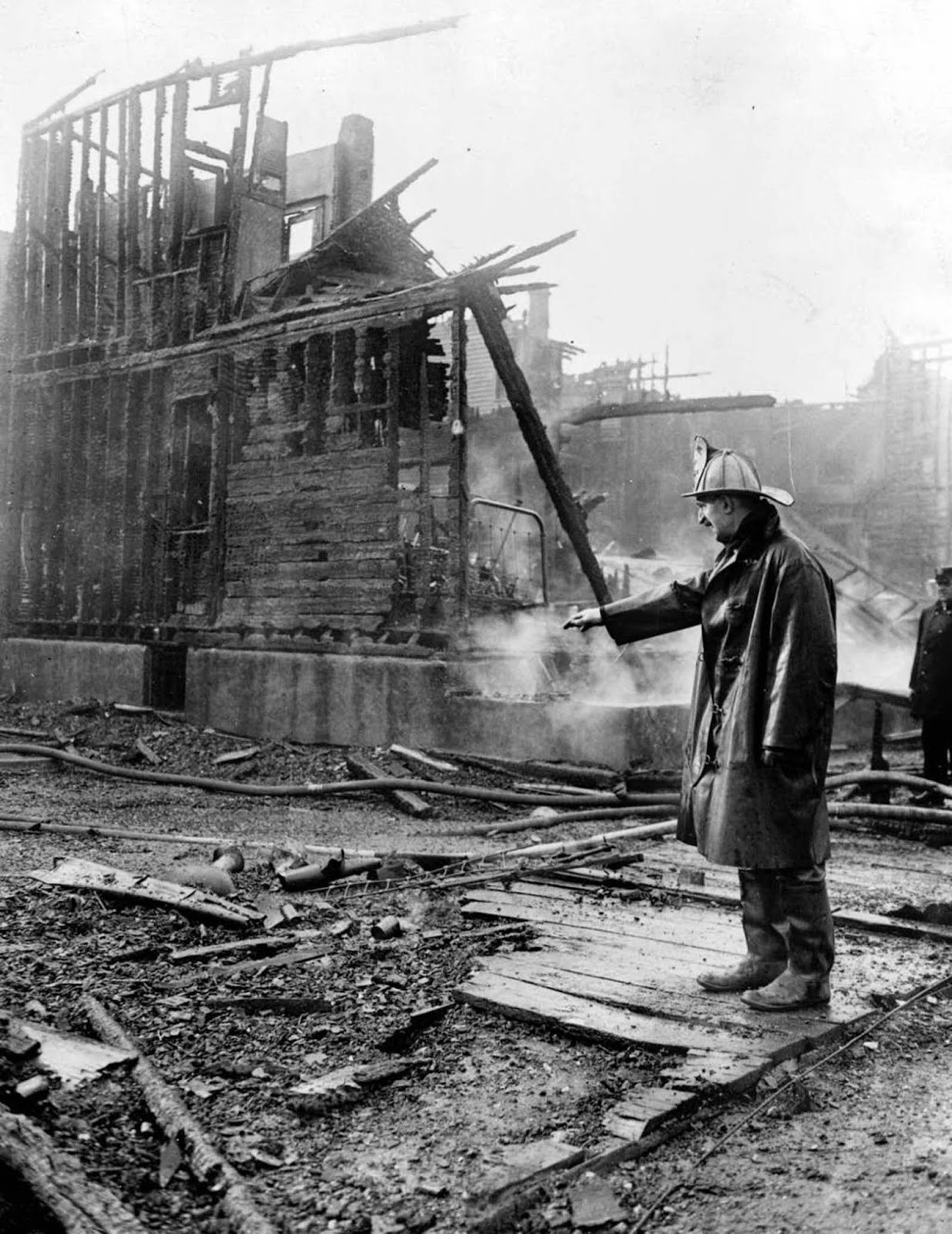 A firefighter looks over a burned out building during the Chicago race riots of 1919.