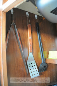 More command hooks for under the kitchen counter to hang BBQ tools :: OrganizingMadeFun.com
