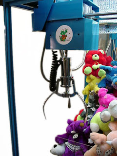 ... das Máquinas com Garras metálicas para tirar Brindes