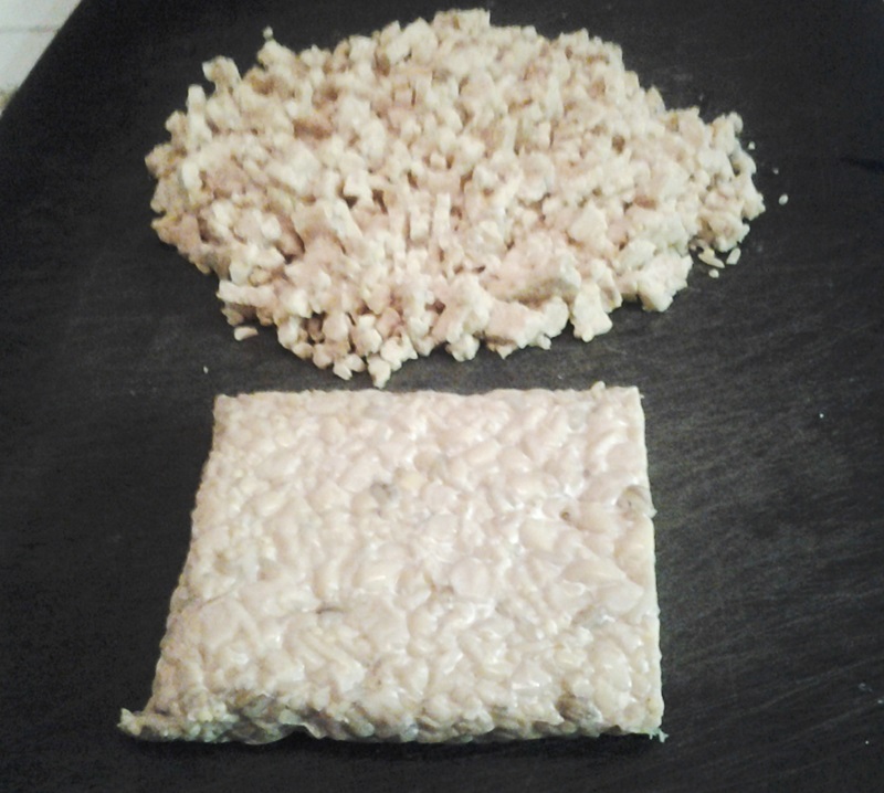 vegan woman Meatless Ground Beef style Tacos made with Tempeh