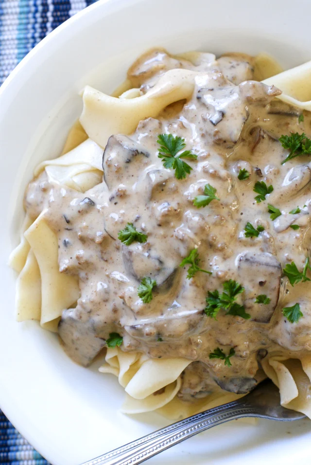 Mushroom Ground Beef Stroganoff is a budget-friendly, easy to make, creamy, comfort food classic that will take the stress out of cooking dinner on a busy weeknight!
