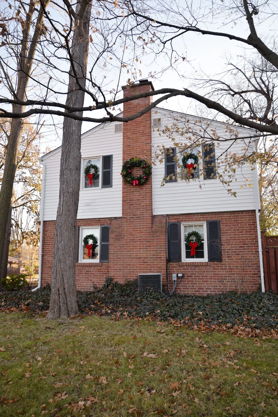 white house black shutters christmas wreaths, wreath on chimney