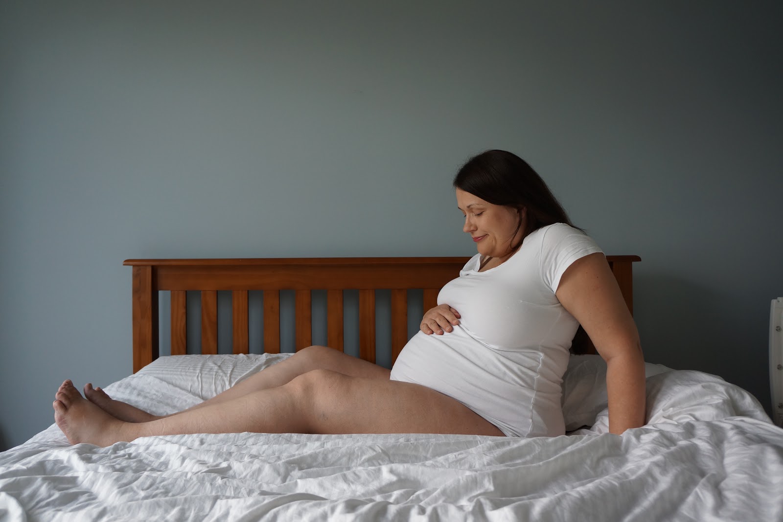 pregnant woman on bed