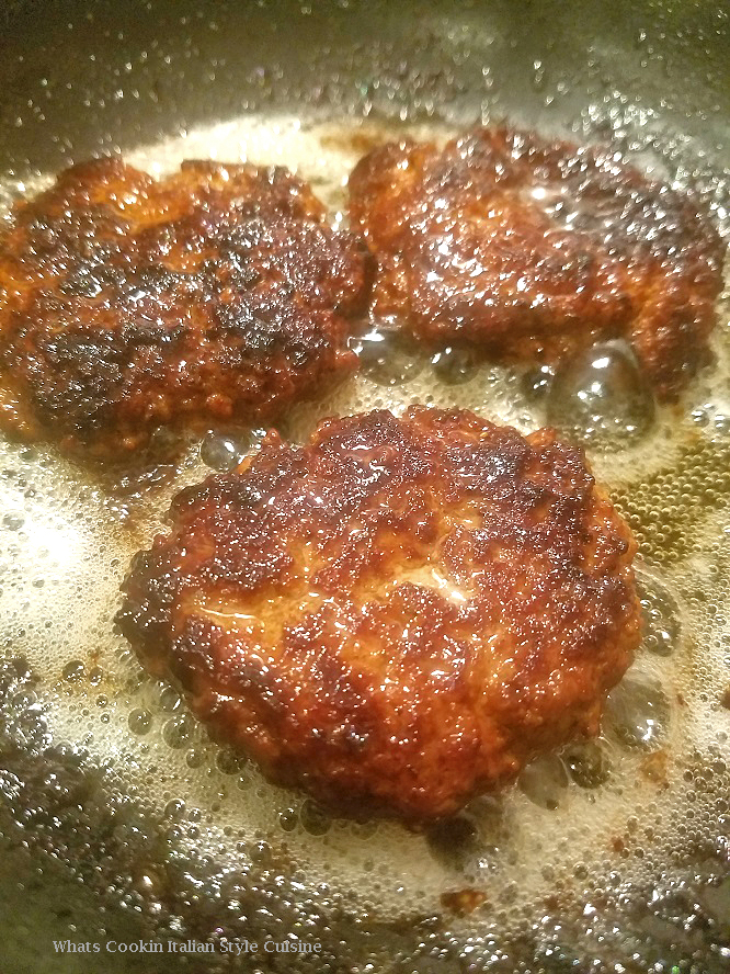 These are sauteed in oil pork breakfast sausages made into a pattie for breakfast . These patties are cooked dark and crispy on top