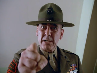 Gunnery Sergeant R. Lee Ermey pointing and yelling at the viewer