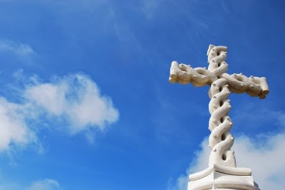 White cross against blue sky