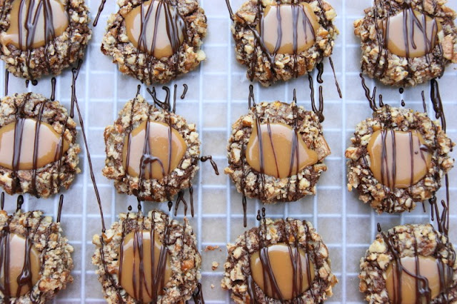 Insanely Delicious Turtle Cookies ... soft chocolate-pecan thumbprint cookies filled with caramel.  Yum! www.thekitchenismyplayground