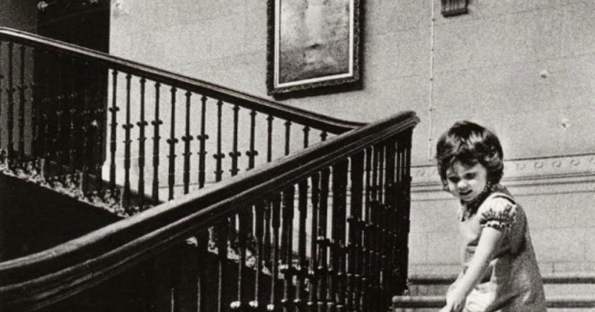 A girl walking an alligator down the stairs, c. 1960s vintage everyday