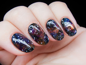 Jewel-toned galaxy nails by @chalkboardnails