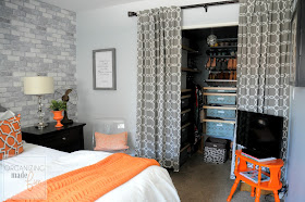 Gray and Orange Master Bedroom with faux brick wall