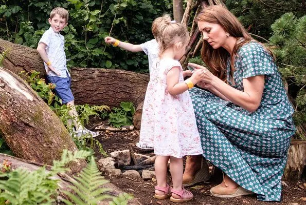 Kate Middleton wore a short sleeved printed dress by Sandro, Castaner Carina wedge, Accessorize polly petal drop earrings