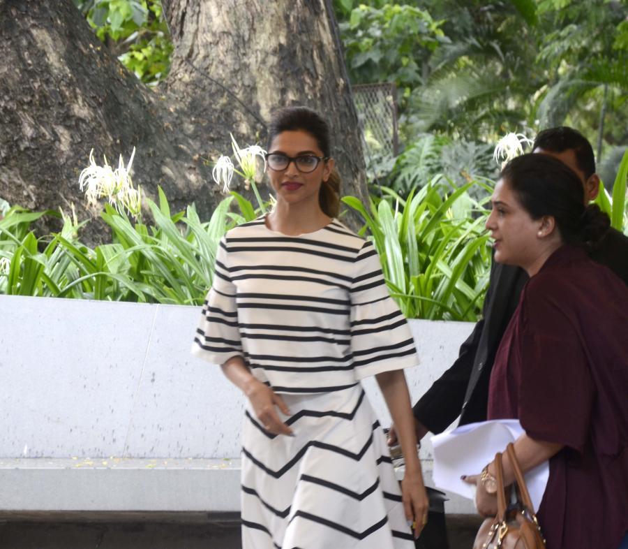 Deepika Padukone Stills In White Dress With Glass