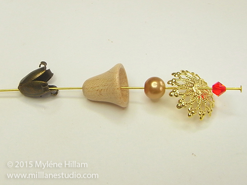 Beads and findings strung onto a head pin