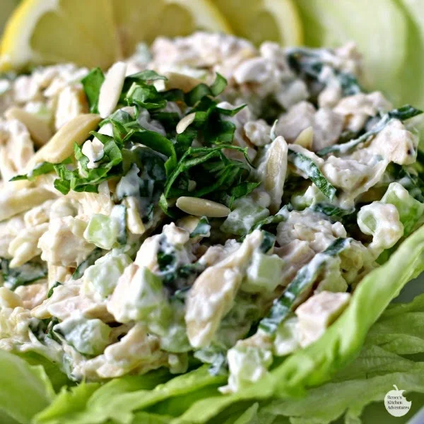 Creamy Lemon and Fresh Basil Chicken Salad by Renee's Kitchen Adventures ready to eat on a lettuce leaf.
