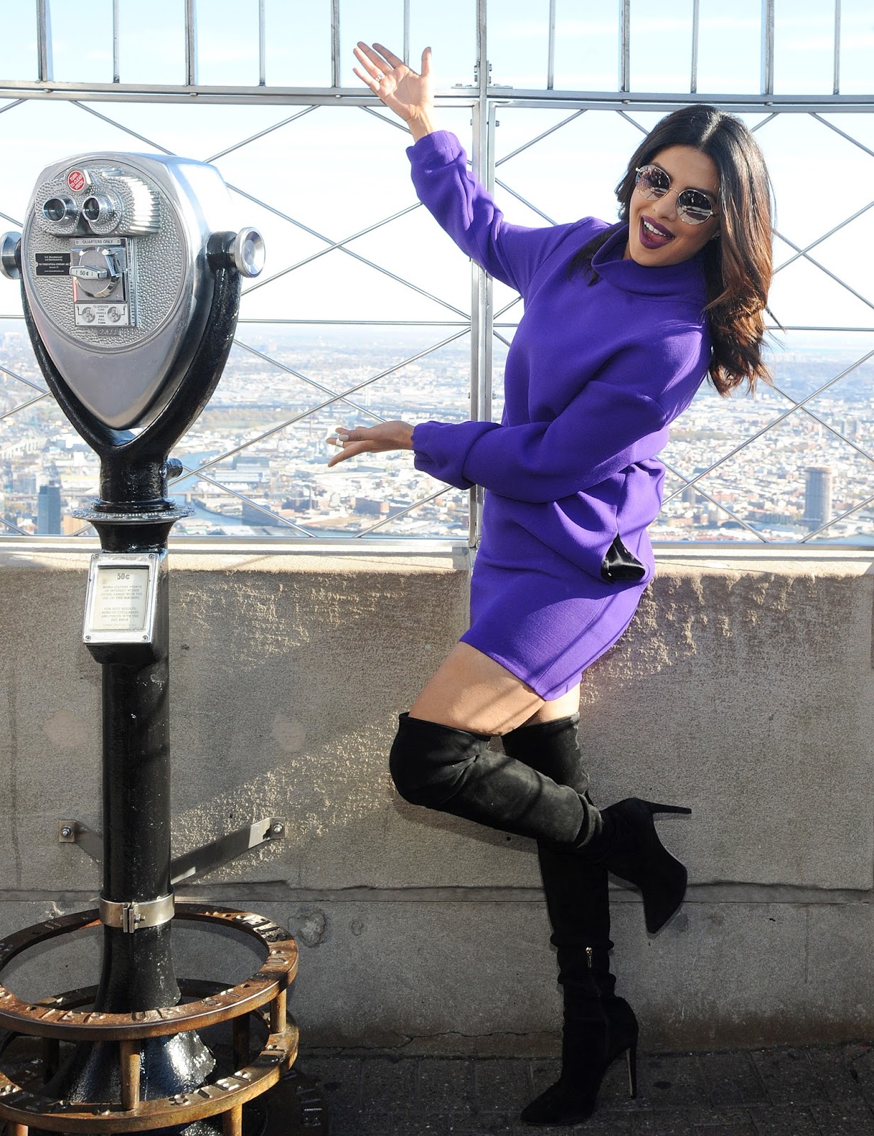 Priyanka Chopra Looks Sexy In a Purple Short Dress and Black Thigh High Boots During â€œQuanticoâ€ Promotion at The Empire State Building in New York City