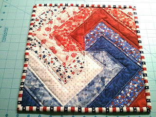 "Spiral Tutorial" is a Free Quilted Mug Rug Pattern designed by Karen from The Recipe Bunny!