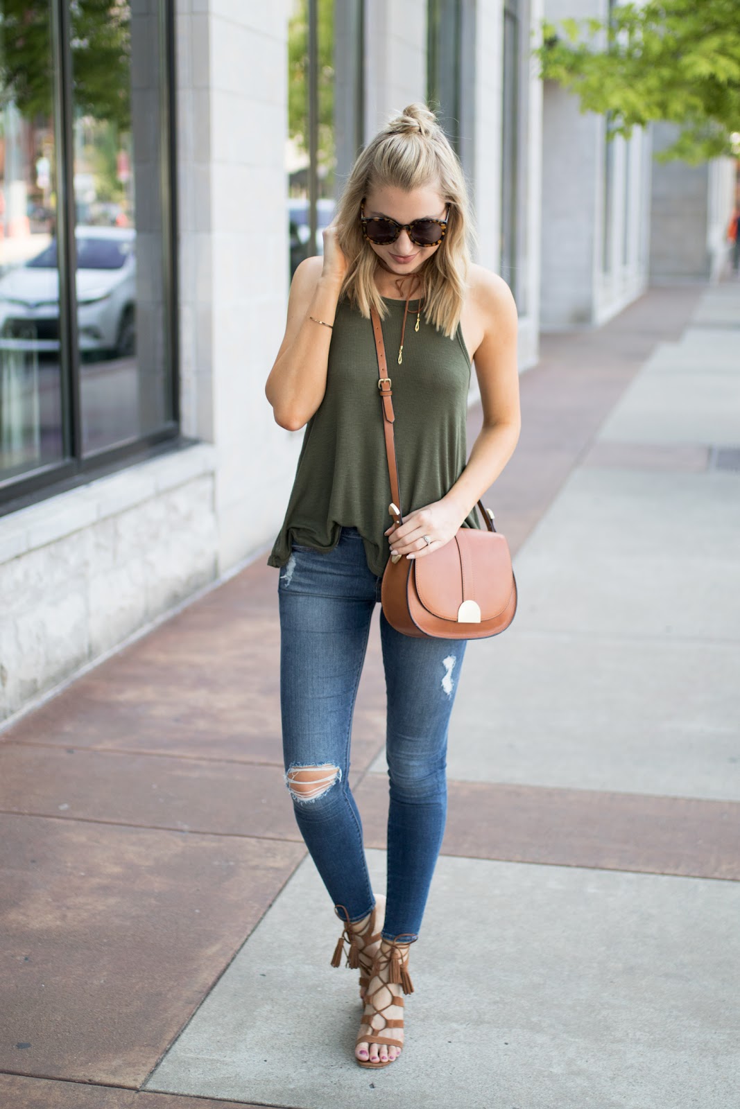 Olive green tank with jeans and brown accessories