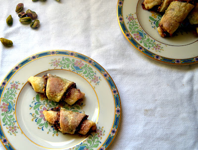 Cherry Pistachio Rugelach with tart cherry preserves, nutty pistachios with brown sugar and cinnamon and rolled together in a decadent cream cheese dough. 