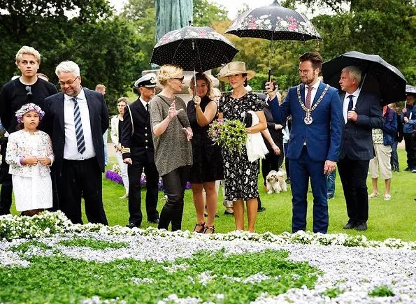 Crown Princess Mary wore a black and white floral dress by Ralph Lauren and Marianne Dulong pearl earring, Gianvito Rossi pumps