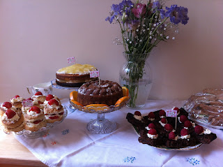 delicious homemade cakes on vintage cake stands made by the bridesmaid for the hen party