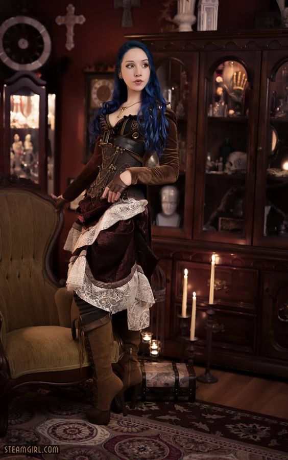 Girl in a Steampunk costume with luxe velvet fabrics and a skirt with lace trim. Women's steampunk fashion and clothing.