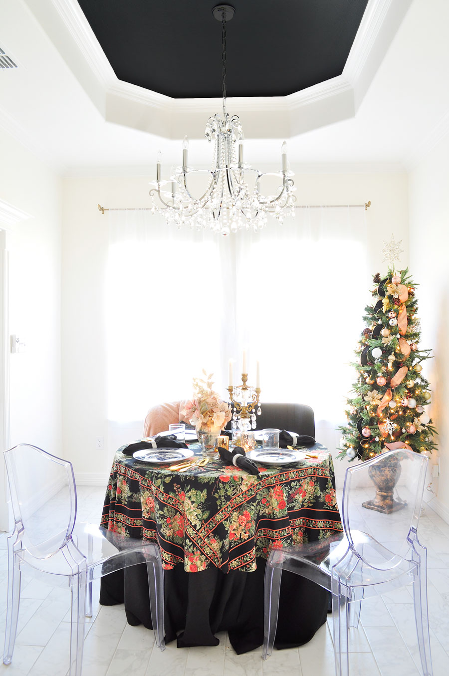 A small dining area or breakfast nook gets glammed up for the holidays with touches of blush, gold, and silver, plus florals and chinoiserie and vintage home decor elements.