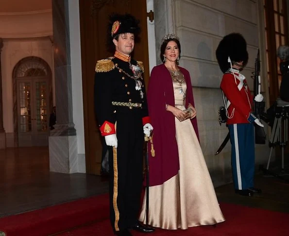 Crown Prince Frederik, Crown Princess Mary, Prince Jaochim and Princess Marie attend New Year's Banquet at Amalienborg Palace. Crown Princess Mary diamon tiara, Princess Marie diamond tiara, diamond earrings, Princess Mary wore diamond earrings wore satin govn and cape